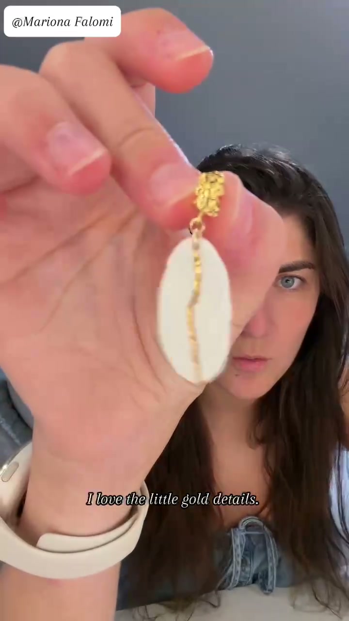 Mariona Falomi unboxing and wearing Isle of Warm Light porcelain earrings by ZELIN ART.