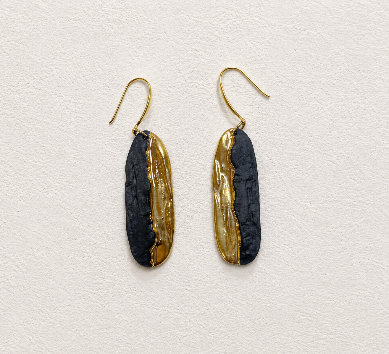 Dusk Gold and the Shore handmade ceramic earrings showing a slender ceramic form and warm gold-plated detail by ZELIN ART.