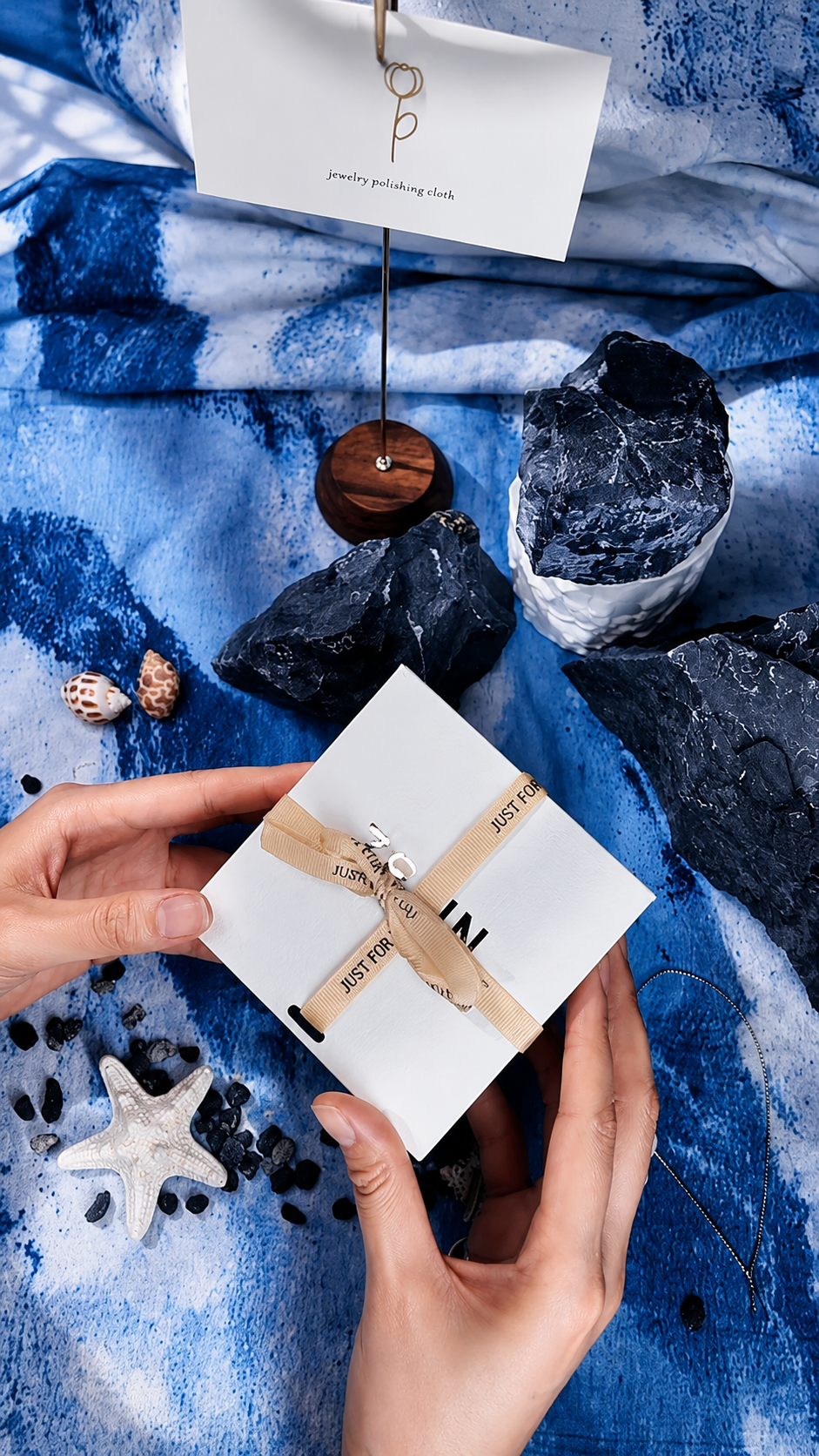 Gift-ready packaging for ZELIN ART handmade porcelain jewelry arranged for opening.