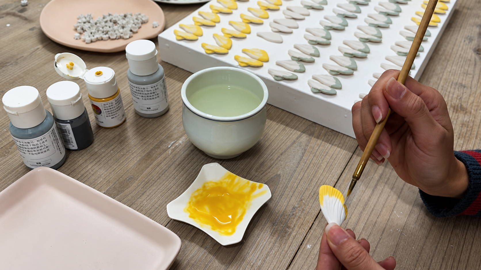 Hand painting detail on Jingdezhen porcelain jewelry by ZELIN ART.