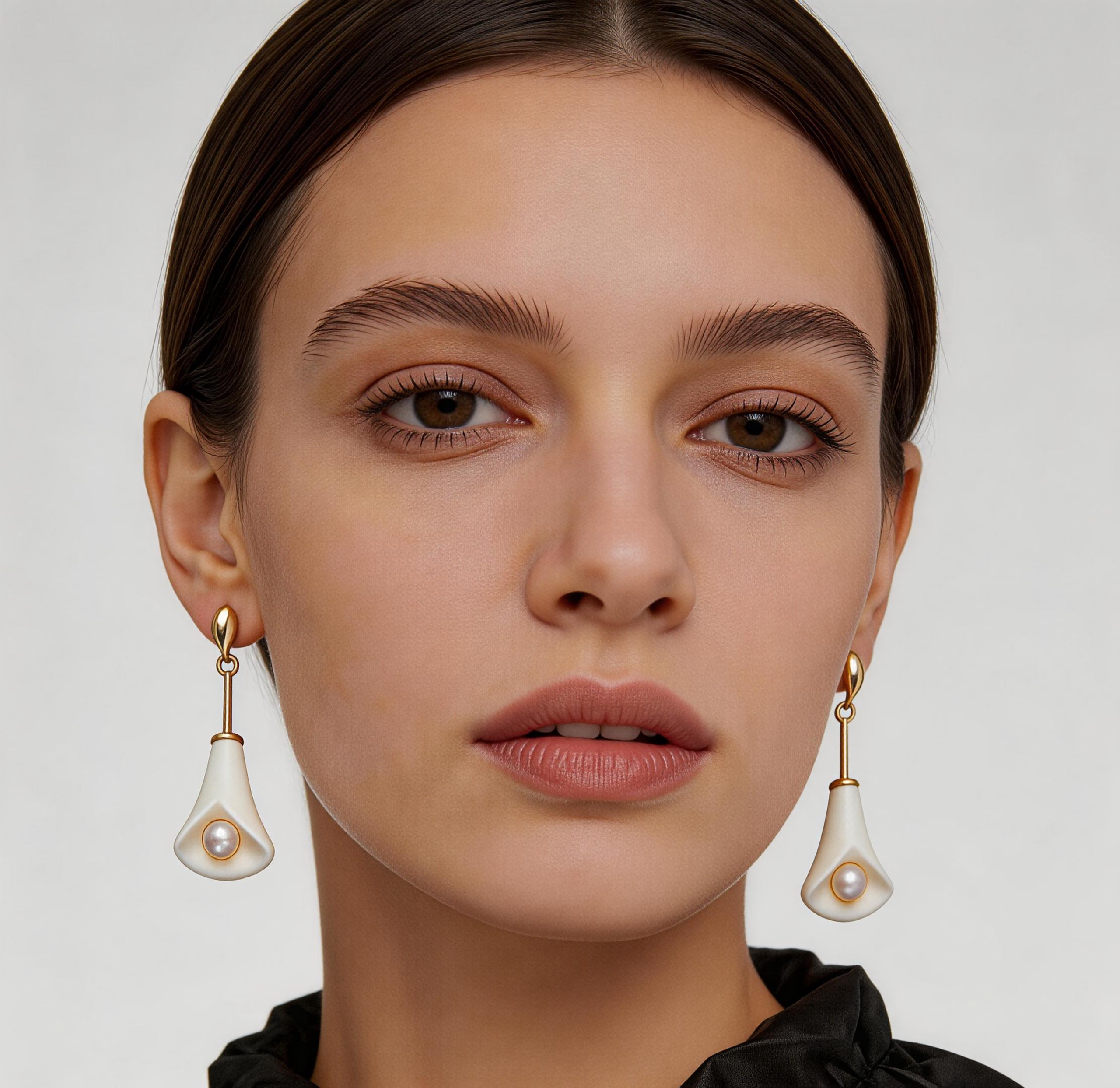 Close-up styling detail of LIN floral porcelain earrings and ceramic petal edges.