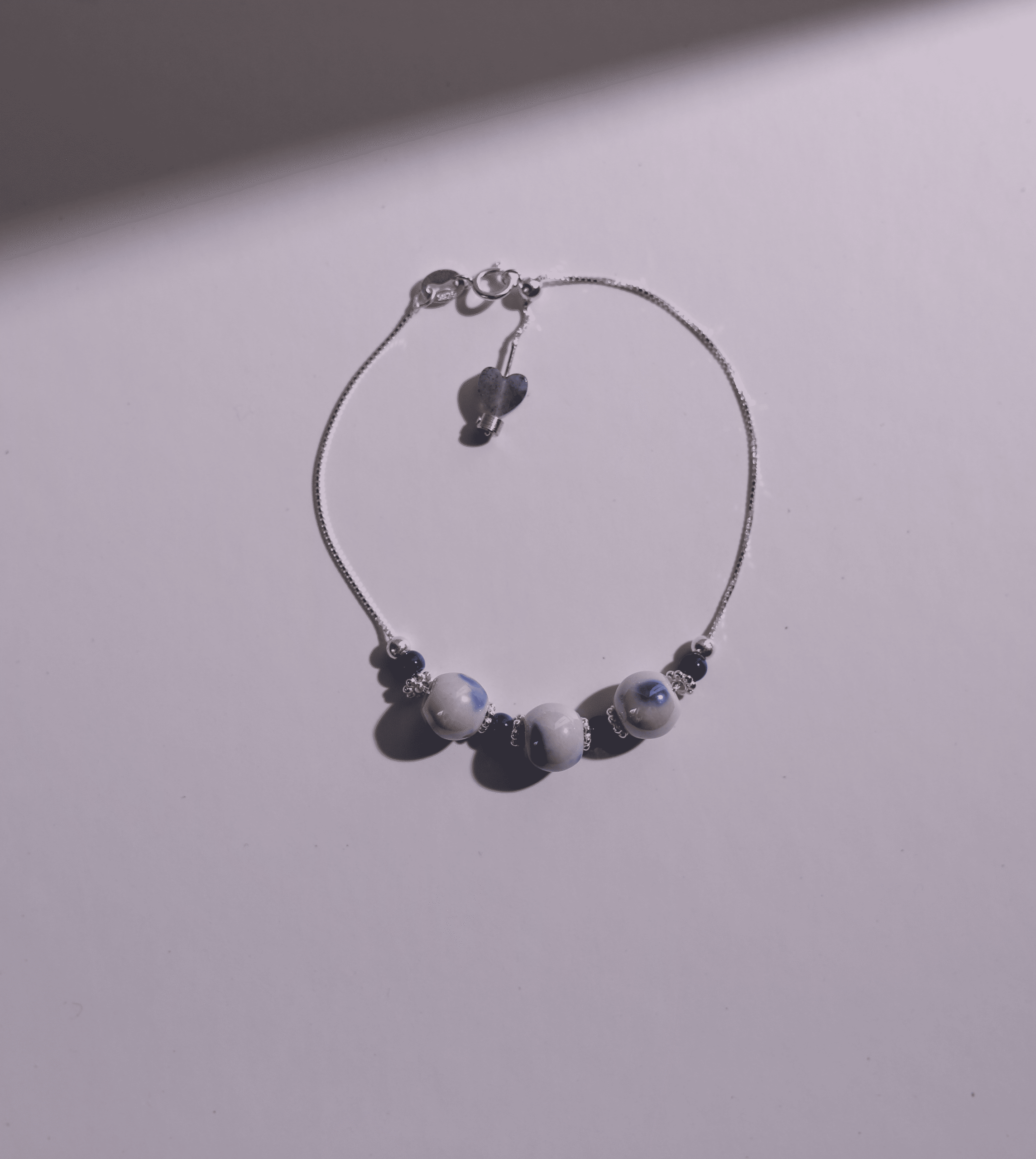 Blue porcelain bracelet product still life